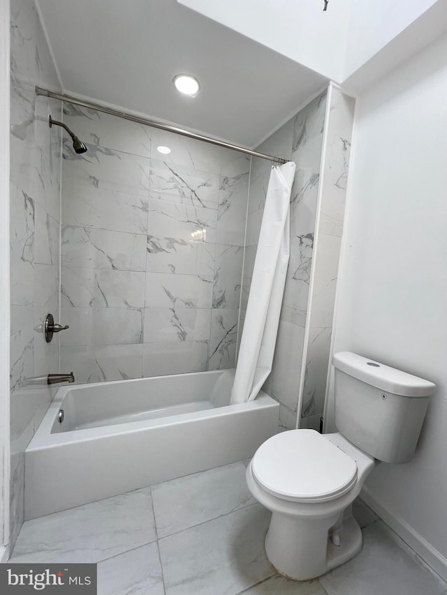 bathroom with toilet and shower / bath combo