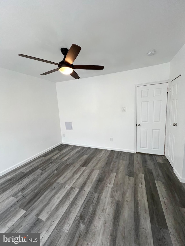 empty room with dark wood-type flooring