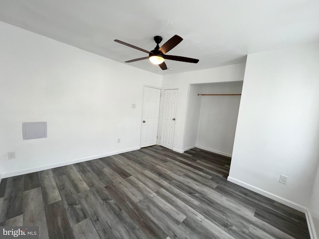 unfurnished bedroom featuring ceiling fan and dark hardwood / wood-style floors