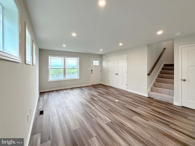 unfurnished living room featuring hardwood / wood-style flooring