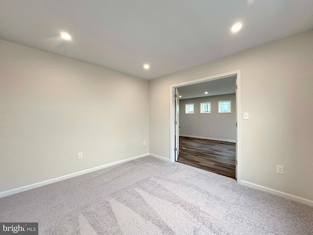 unfurnished room featuring carpet