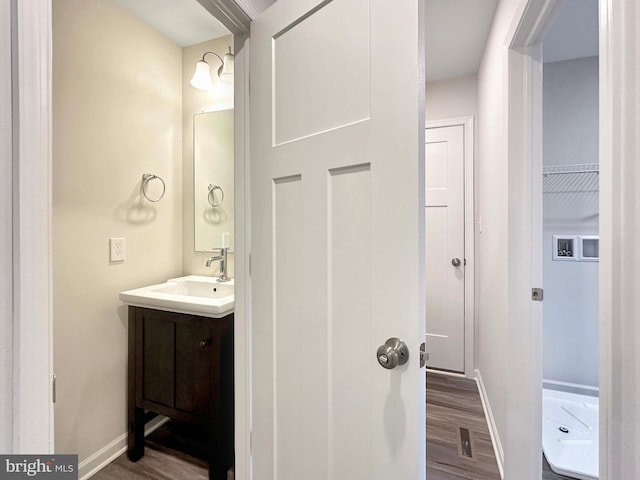 bathroom featuring hardwood / wood-style flooring and vanity