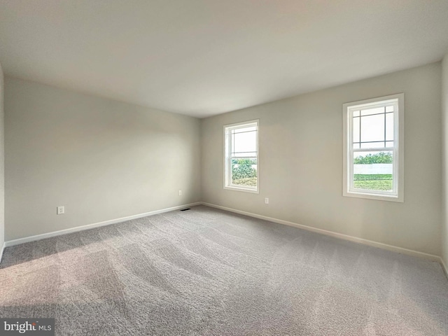 unfurnished room featuring carpet floors