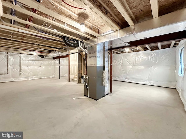 basement featuring heating unit