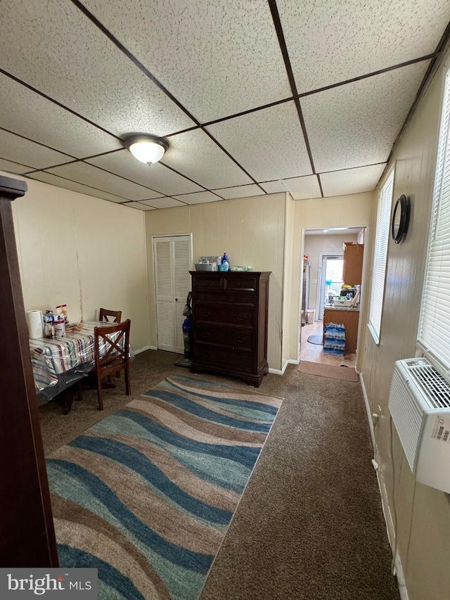 bedroom with carpet and a drop ceiling