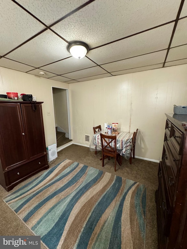 sitting room featuring a paneled ceiling and carpet flooring