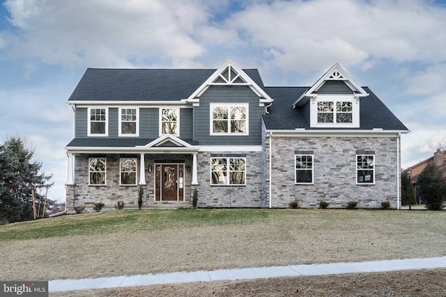 craftsman-style home with a front yard