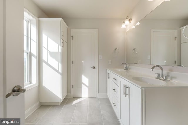 bathroom with vanity and tile patterned flooring