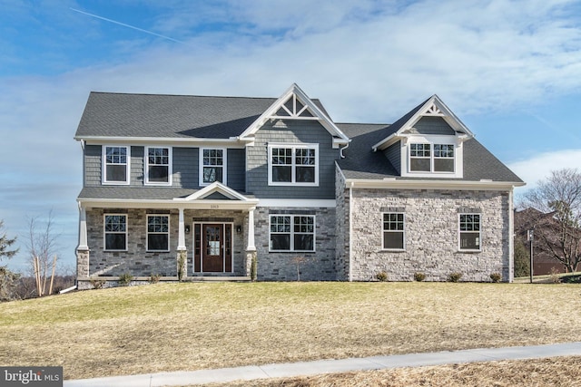 craftsman house with a front lawn