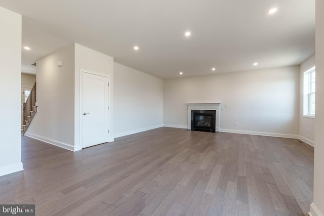 unfurnished living room featuring light hardwood / wood-style floors