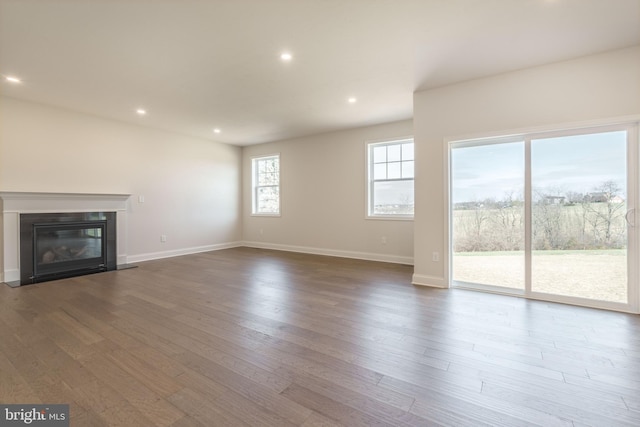 unfurnished living room featuring hardwood / wood-style flooring