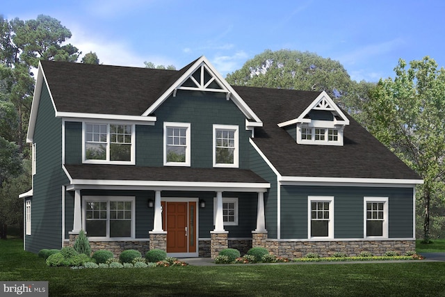 craftsman inspired home with a front lawn