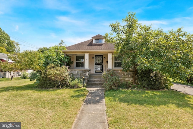 bungalow with a front yard