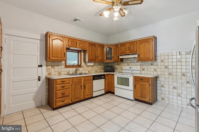 kitchen with white appliances, light tile patterned floors, sink, ceiling fan, and decorative backsplash