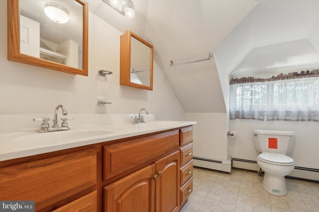 bathroom with a baseboard heating unit, tile patterned flooring, toilet, and vanity