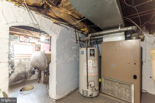 utility room with gas water heater