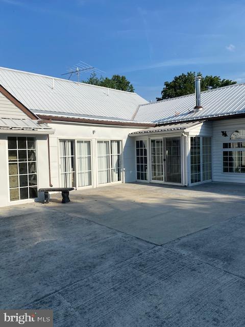 back of house featuring a patio area