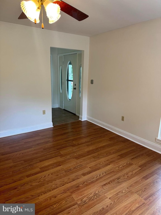 interior space with ceiling fan and wood-type flooring