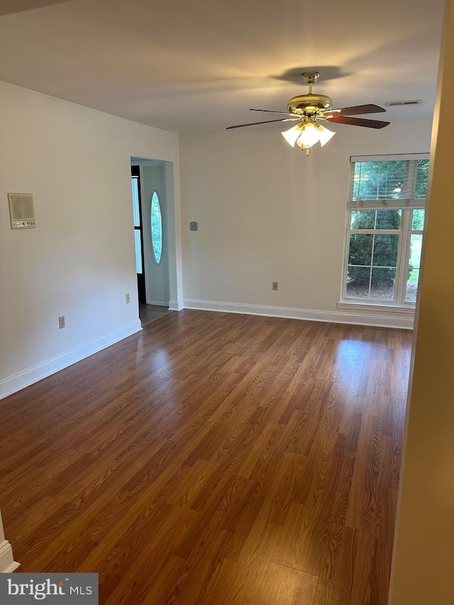 empty room with ceiling fan and wood-type flooring