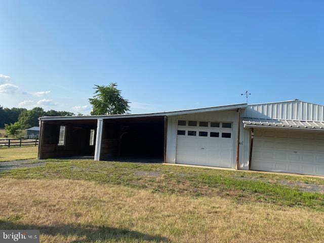 garage with a yard