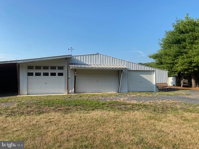 garage featuring a yard