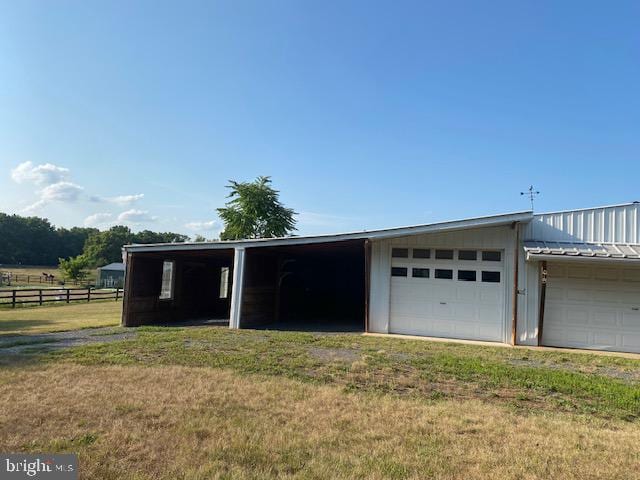 garage with a lawn