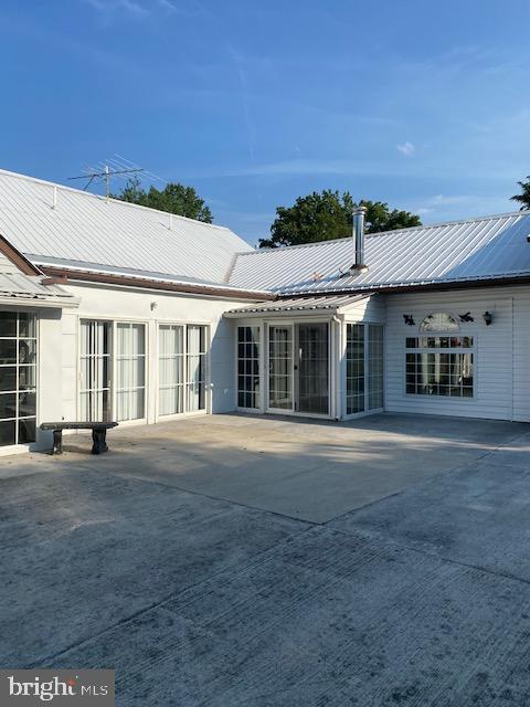 rear view of house featuring a patio area