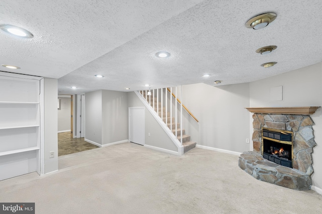 basement featuring light carpet and a textured ceiling