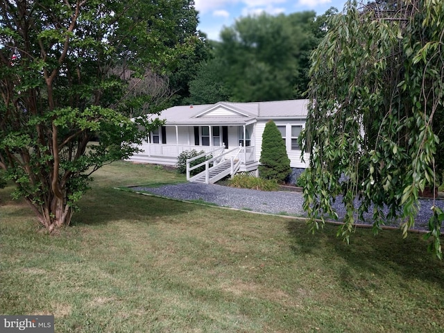 single story home featuring a front yard and covered porch