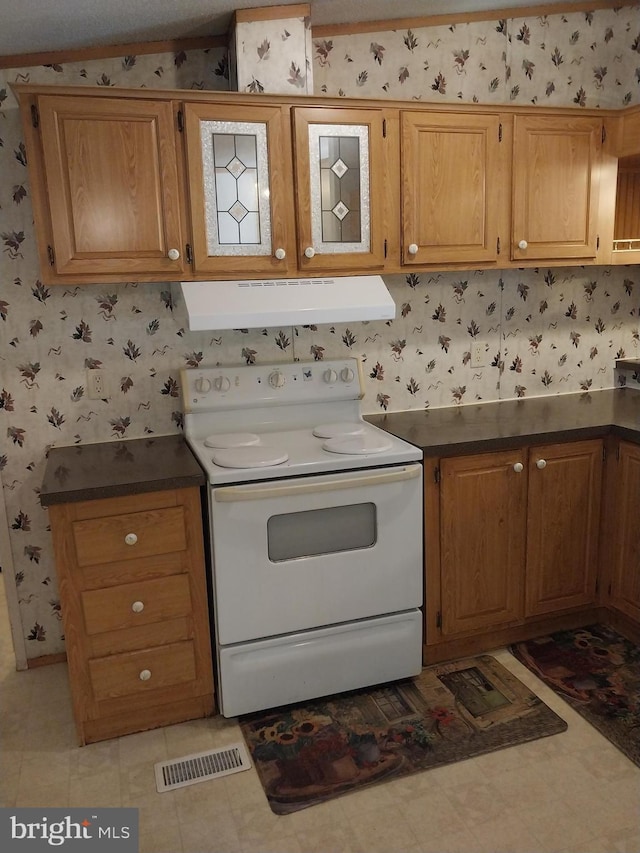 kitchen featuring white electric stove