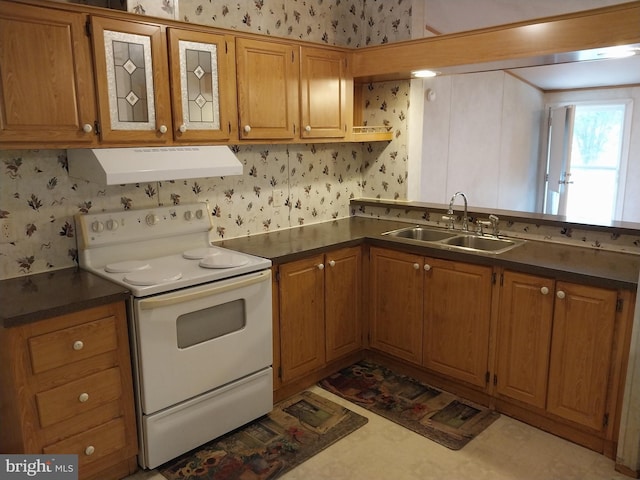 kitchen featuring sink and white range with electric stovetop