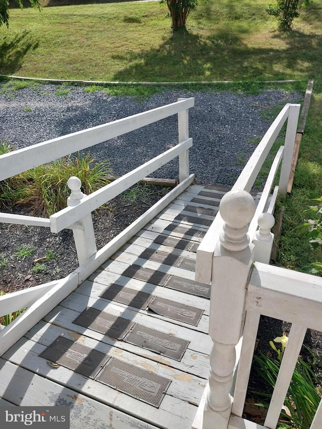 wooden deck with a yard