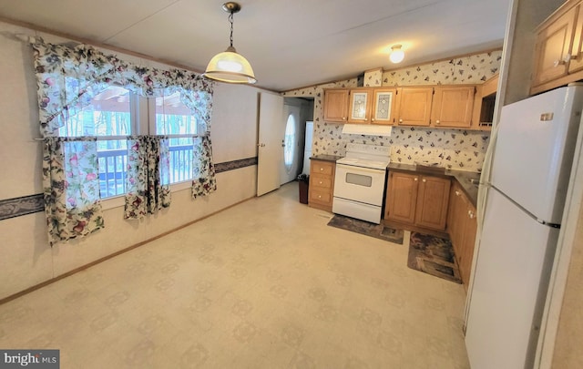 kitchen with pendant lighting and white appliances