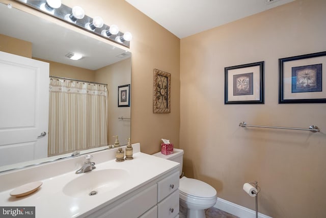 bathroom with vanity and toilet