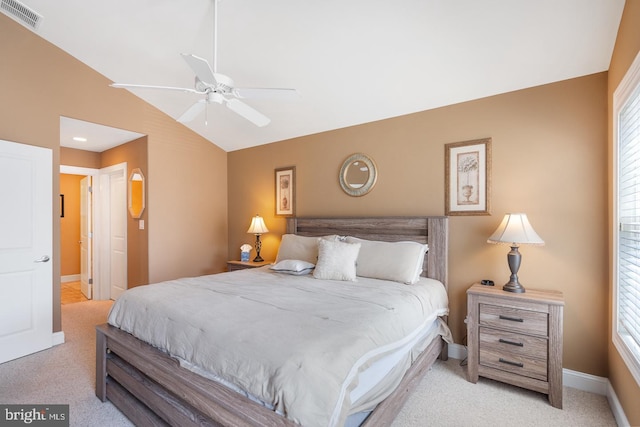 bedroom featuring light carpet, multiple windows, vaulted ceiling, and ceiling fan