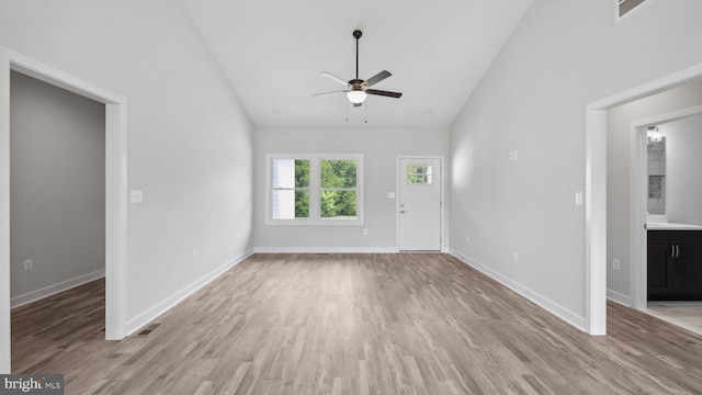 unfurnished living room featuring ceiling fan, high vaulted ceiling, and light hardwood / wood-style flooring