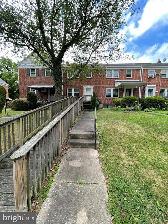 view of home's community with a lawn