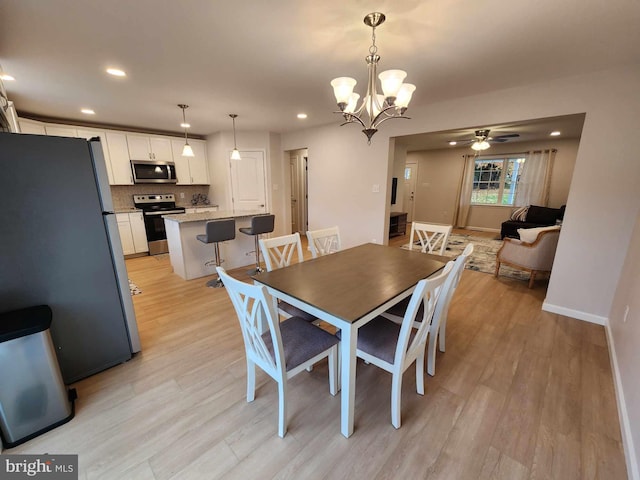 dining space featuring light hardwood / wood-style flooring and ceiling fan