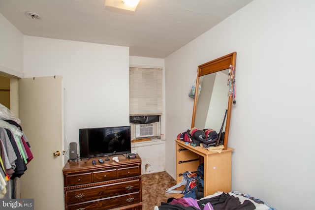 bedroom with carpet and cooling unit