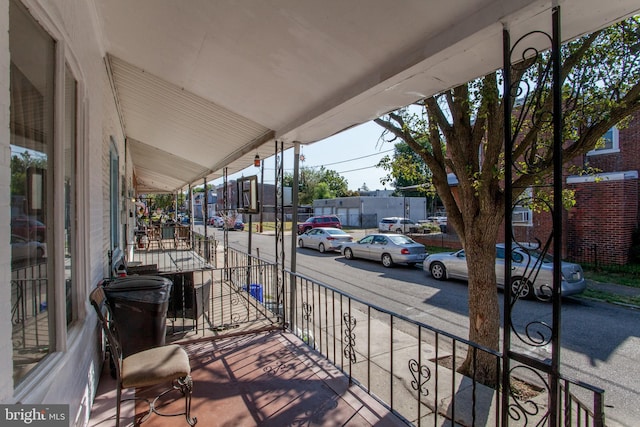 balcony featuring a porch