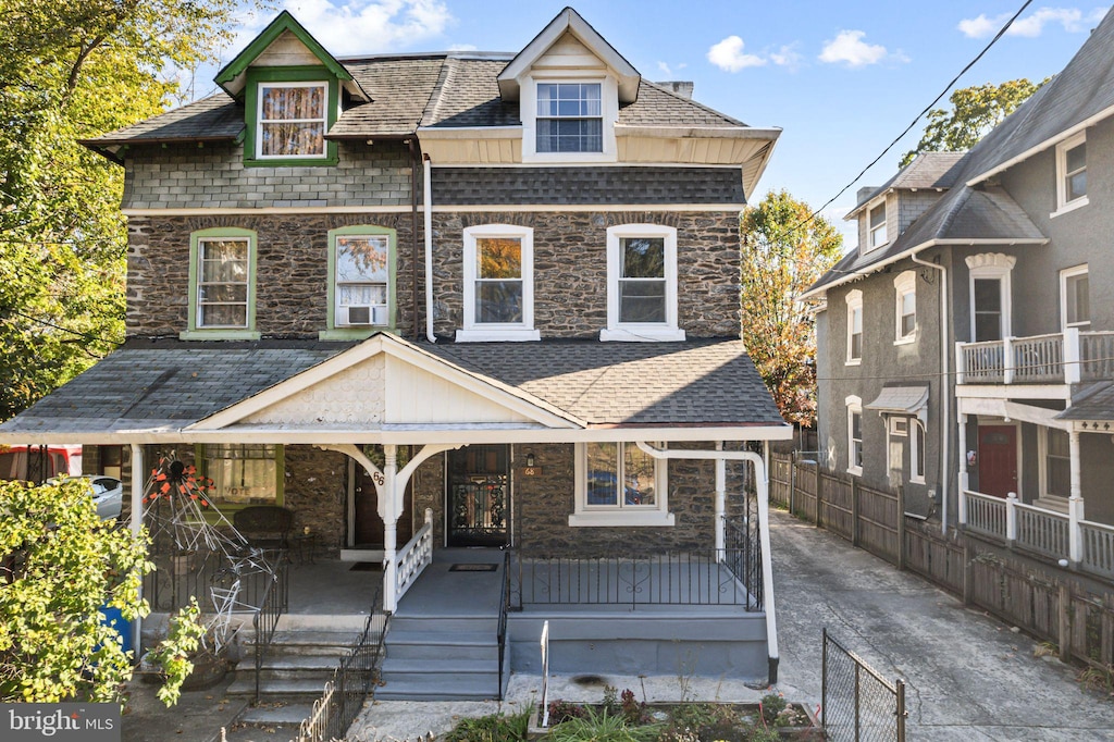 view of front of house featuring cooling unit and covered porch