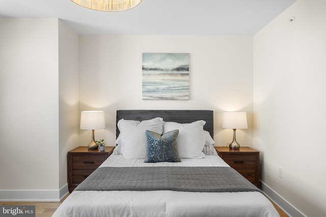 bedroom with hardwood / wood-style floors