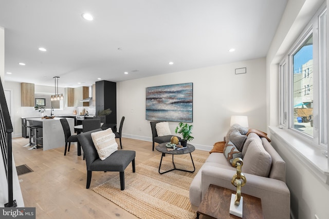 living room with light hardwood / wood-style floors