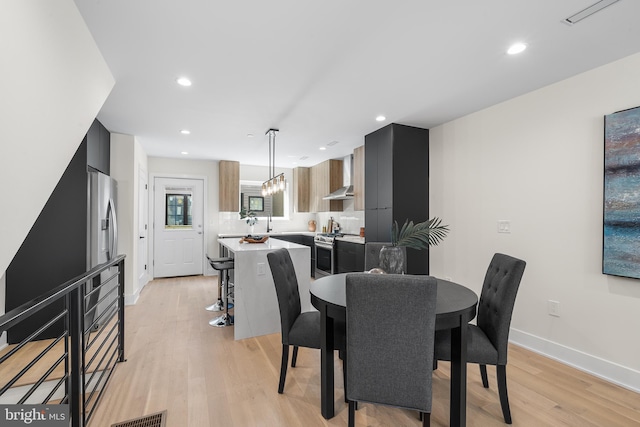 dining space featuring light hardwood / wood-style flooring