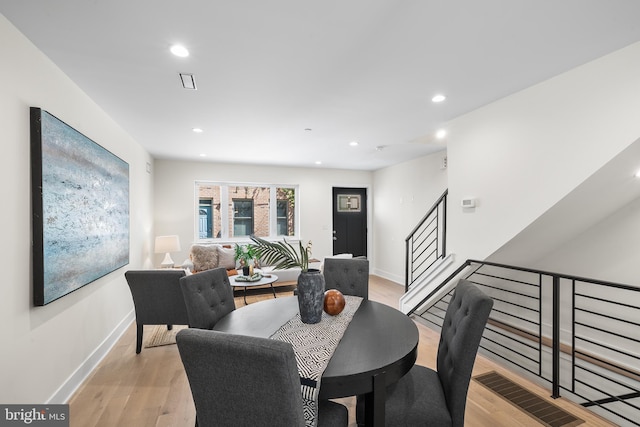 dining area featuring light wood-type flooring