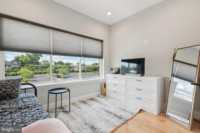 bedroom with light hardwood / wood-style floors