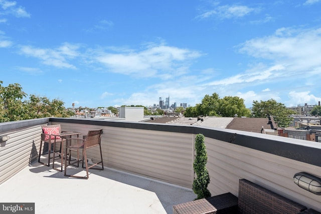 view of patio featuring a balcony