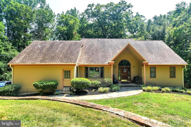 ranch-style house with a front yard