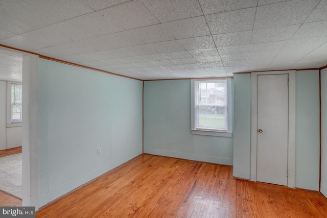 empty room with light hardwood / wood-style flooring