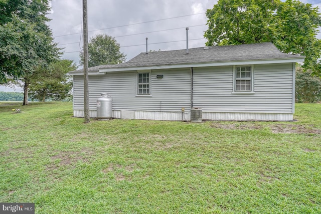 view of side of home featuring a yard